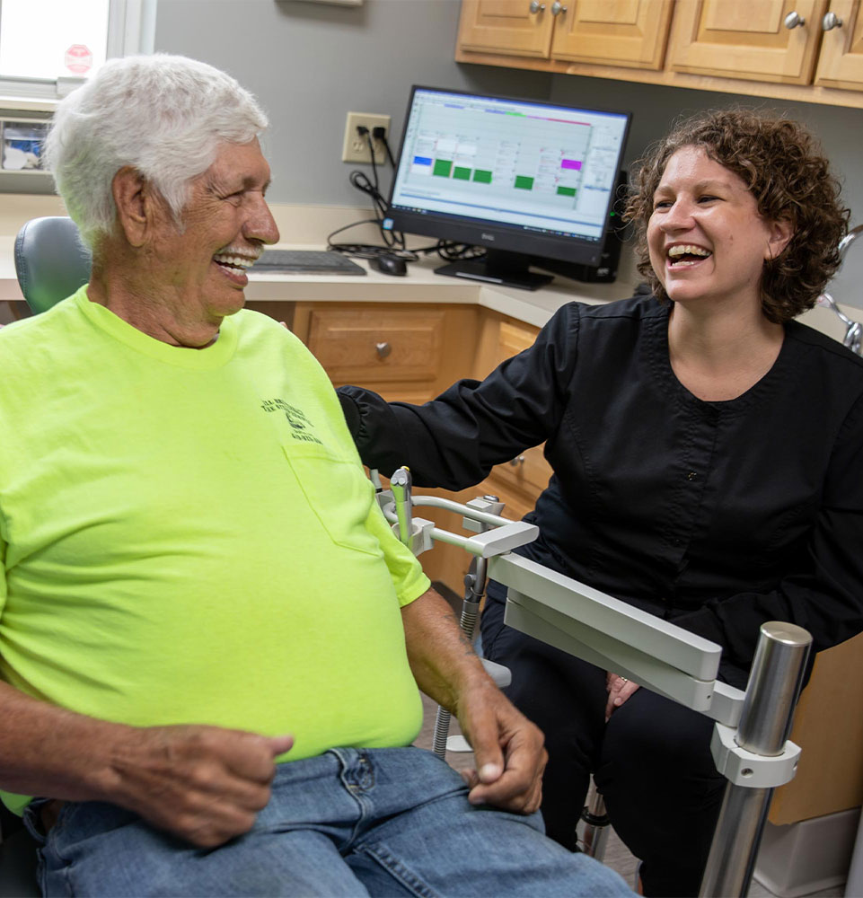 dental patient laughing with hygienist